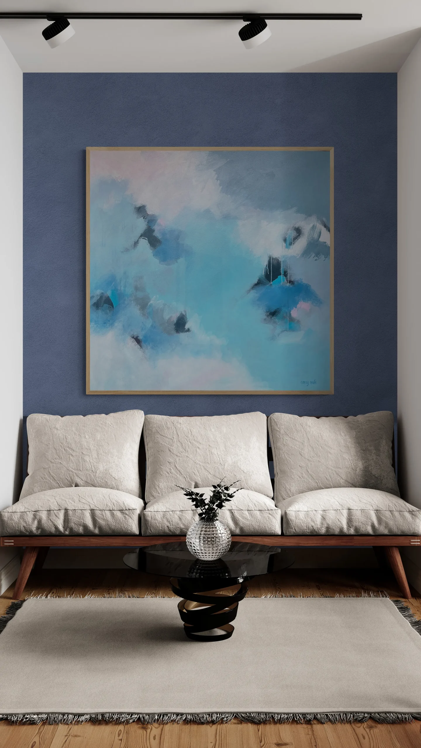 living room with sofa and fancy table scaled paintings 